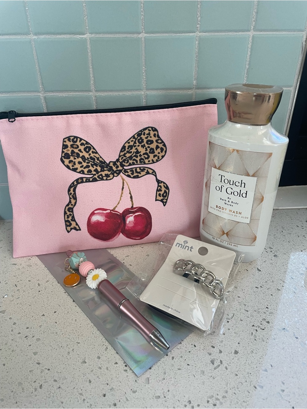 Bundle of 4-Bow make up pouch, body wash, handmade pen, and hair tie